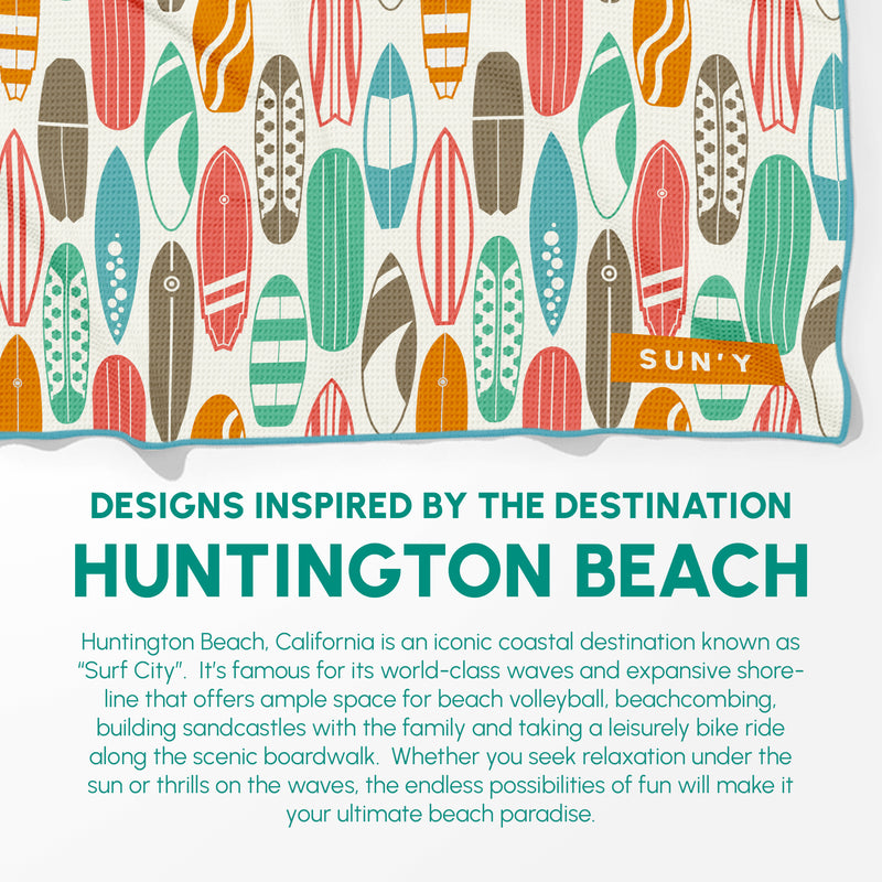 Huntington sand free towel draped on beach chair at a California beach destination