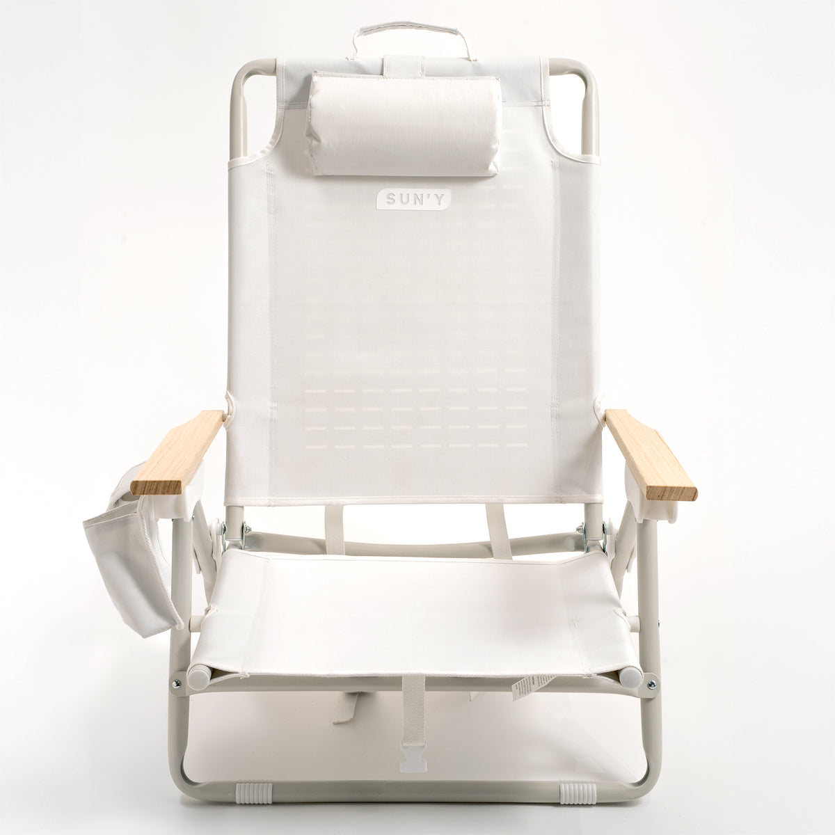 SUN'Y ESCAPES lightweight backpack beach chair in Seashell White, front view showing beachwood armrests and detachable headrest